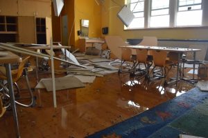 School facility with water damage illustrating the importance of property disaster insurance coverage for educational facilities