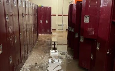 School locker room damaged by flooding, requiring restoration and renovation projects
