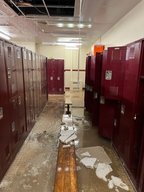 School locker room damaged by flooding, requiring restoration and renovation projects